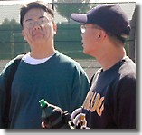 Lil' J intimidating the cameraman as sibling Tony Nguyen watches